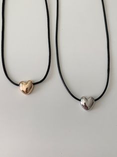 The Vintage-inspired Puffed Heart Charm on a Sliding Nylon Cord Chain adds a touch of Y2K vibe to your outfit while also providing a modern cord necklace look.Easily adjust the length with the sliding ball feature. Please be aware that the charm is intentionally designed to have a bold and pronounced appearance. Due to its size and unique design, light scratches may occur during the crafting process and over time with regular use. Please understand that these minor imperfections are not consider Trendy Adjustable Heart Charm Necklace, Adjustable Charm Necklaces For Friendship, Adjustable Rose Gold Charm Necklaces, Everyday Adjustable Heart Pendant Charm Necklace, Heart Pendant Necklace With Adjustable Cord, Trendy Adjustable Heart Pendant Charm Necklace, Adjustable Heart Charm Necklaces For Everyday, Y2k Vibes, Puffed Heart