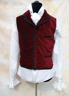 Velvet Dr Who waistcoat with braid trim by Obsidian Gothic, great for 11th Dr cosplay, steampunk or gothic style. Check out the Obsidian Gothic Clothing shop for shirts to go with this style. The waistcoat is made from cotton velvet & is fully lined & backed in satin. There is a full collar and 4 pockets at the front waist & chest. The waistcoat fastens with ornamental buttons (buttons may vary from those shown). Black braid trims the collar, top front, bottom edges & pocket welt Edwardian Halloween, Red Velvet Winter, Mens Formal Vest, History Bounding, Gothic Cosplay, Goth Vampire, Steampunk Goth, Formal Vest, Gothic Clothing