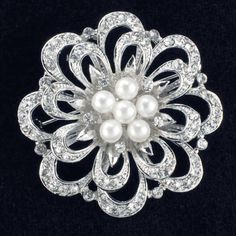 Floral brooch made from crystal Rhinestones with five pearls in the center; base plated in Silver color ; Width: 1-3/4 inches. Fabric Flower Pins, Cheap Diamond Rings, Bijoux Art Nouveau, Bridesmaid Pearls, Turquoise Jewelry Native American, Wedding Brooch, Wedding Bridal Jewellery, Pearl Brooch, Flower Brooch