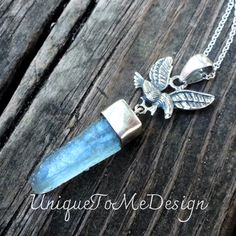 "Natural Aqua Aura Quartz Point Sterling Silver Eagle Pendant on a Sterling silver Rolo chain ❤︎Featured in this listing is a sterling silver, handmade, natural stone pendant.  This lovely handmade pendant features a beautiful, Large Aqua Aura Quartz Point stone that has been set into polished Sterling Silver.  Just above is a detailed Eagle with a large bail above!   ❤︎Made with all Sterling Silver and comes featured on a Sterling Silver chain (you pick length) Gemstone(s): Natural Aqua Aura Qu Sterling Silver Spiritual Crystal Gemstone Necklace, Sterling Silver Gemstone Crystal Necklace Spiritual Style, Spiritual Sterling Silver Crystal Gemstone Necklace, Sterling Silver Crystal Gemstone Necklace In Spiritual Style, Silver Labradorite Crystal Necklace As A Gift, Silver Labradorite Crystal Necklace For Healing, Silver Labradorite Crystal Necklace Gift, Silver Labradorite Crystal Necklace For Gift, Handmade Spiritual Sterling Silver Crystals