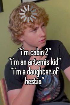 a young boy sitting on top of a chair with the words i'm cabin 2 im