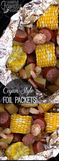 corn on the cob with sausage and potatoes in foil wrapped over an open grill