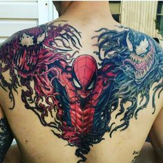 the back of a man's body with tattoos on his chest and spider - man