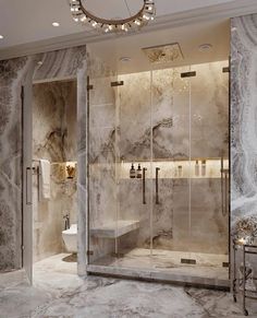 an elegant bathroom with marble walls and flooring, including a walk - in shower