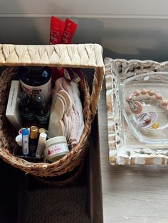 a basket filled with personal care items sitting on top of a table next to a tray