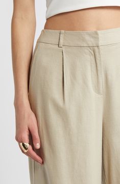 On-trend wide legs lend sophisticated drama to lightweight linen-blend pants designed with a crisp pleated front. 29" inseam; 20 1/2" leg opening; 12" front rise; 16" back rise (size 8) Zip fly with hook-and-bar closure Front slant pockets 53% linen, 44% rayon, 3% spandex Machine wash, tumble dry Imported Spring Workwear Wide Leg Pants In Flax, Flax Wide Leg Pants For Spring Workwear, Spring Flax Wide Leg Pants For Work, Flax Wide Leg Pants For Work In Summer, Relaxed Fit Wide Leg Pants For Formal Summer Occasions, Relaxed Fit Wide Leg Pants For Summer Formal, Summer Flax Wide Leg Work Pants, Modern Linen Wide Leg Pants For Summer, Elegant Flax Wide Leg Pants For Spring