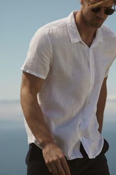 Made from woven linen fabric, this shirt exudes a laid-back vibe and can easily be dressed up. With a relaxed fit and traditional features, this short sleeve shirt is perfect for warm weather seasons. You can wear it on its own or layer it over you favorite tee. Linen Button Down Shirt Men, Men’s White Linen Shirt, Mens Outfits Linen Shirt, Linen Shirt Man, Mens Outfits Button Up, Linen Shirt Outfit Men’s, Men’s Engagement Photo Outfits Dressy, Hot Weather Outfits Men, White Linen Shirt Outfit