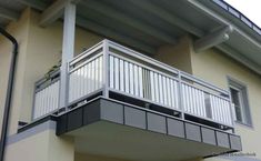 an apartment building with balcony and balconies