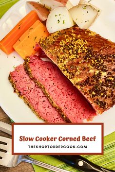 slow cooker corned beef on a plate with carrots and potatoes