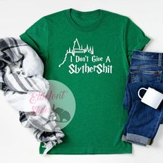 I Don't Give A SlytherShit Shirt Slytherin Shirt, Harry Potter House, Universal Shirts, Potter Head, Motherhood Shirts, Harry Potter Shirts, Sarcastic Tees, The Wizard, Funny Graphic Tees