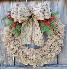 a burlock wreath with holly and red berries