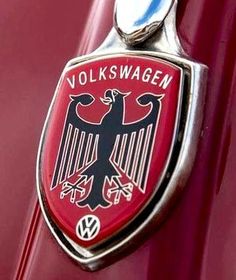 an emblem on the side of a red car