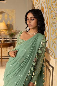 Pre draped Mirror work saree with tassels. The blouse is smoked. It can be worn as an off shoulder or with shoulders.
– Non padded
– Saree is lined. Indo Western Saree, Printed Mirror, Mirror Work Saree, Draped Saree, Mirror Work Blouse, Ruffle Saree, Crepe Saree, Drape Saree, Saree Designs Party Wear