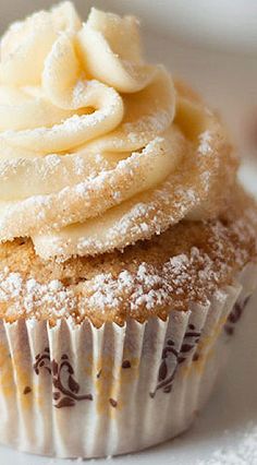 a cupcake with powdered sugar on top