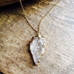 Raw Stone Necklace, Raw Crystal Necklace, Arrowhead Necklace, Boho Layering Necklace, Gold Arrowhead Necklace, Clear Crystal Arrowhead Gold ★Metal- 24k Gold Fill ★Stone- Clear Quartz ★Stone Dimensions- Approx. 1.5 inches long ★Gold Fill Chain Length- 17 inches (Total Length with Stone: 18.5 inches) ★We want you to love your new jewelry and gladly accept returns. ★Arrives ready for gifting and usually ships same day or next day. Check shop announcement for occasional delays. ★Lead- and nickel-fre Bohemian Silver Arrowhead Necklace, Bohemian Brass Necklaces For Rituals, Bohemian Brass Necklace For Rituals, Bohemian Brass Necklaces For Wedding, Bohemian Brass Wedding Necklaces, Bohemian Brass Necklace For Wedding, Spiritual Arrowhead Necklace Gift, Gold Bohemian Crystal Necklace In Brass, Bohemian Gold Crystal Necklace In Brass