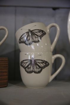 Laura Zindel Mugs are made from white stoneware. These products are microwave and dishwasher safe, and durable enough for everyday use. Color option refers to the color on the inside of the cup. Size: 4.25” Tall, 16 oz. Cricut Butterfly Cup, Butterfly Glass Cup, Butterfly Bowl Ceramics, Butterfly Clay Mug, Butterfly Mugs, 2024 Wishlist, Jacquie Aiche, The Cup, Book Candle