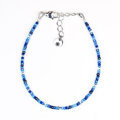 Get ready to shine with this fun and flirty blue and silver seed bead bracelet! The vibrant blue and hint of silver flash are here to add a little pep to your day and sparkle to your style. Lightweight and comfy, it’s perfect for stacking up with your other favorites or rocking solo when you’re feeling bold. Slip it on, and let this dainty little treasure make you feel as fabulous as you look! Materials: size 11/0 glass seed beads beading wire silver plated crimp beads silver plated wire guards Glass Seed Bead Bracelet, Bead Collection, Double Wrap Bracelet, Seed Bead Bracelet, Crimp Beads, Dainty Bracelet, Silver Glass, Chain Silver, Beading Wire