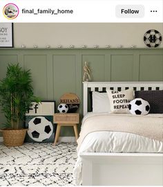 a bed room with a neatly made bed and soccer balls