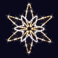 a lighted snowflake on a black background