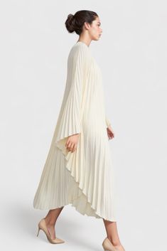 This Pleated Midi Dress is the perfect balance of sophistication and comfort. With a unique and irregular pleats, long sleeves, and round neckline, you can look stylish while staying comfortable all day long.Fabric: Cotton, Polyester Luxury White Pleated Maxi Dress, Luxury Chic Mid-length Maxi Dress, Luxury Elegant Maxi Pleated Dress, Luxury Pleated Dress For Spring, Luxury White Pleated Hem Dress, Luxury Voluminous Midi Dress With Gathered Sleeves, Luxury Elegant Maxi Dress With Pleated Hem, Luxury Pleated Fitted Long Sleeve Dress, Luxury White Maxi Dress With Pleated Bodice