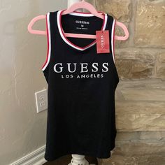 This Is A Brand New Guess Tank Top. Perfect For Summer Black Sleeveless Tank Top With Logo Print, Black Cotton Tank Top With Logo Print, Black Sleeveless Top With Letter Print, Black Logo Print Tank Top For Summer, Black Crew Neck Tank Top With Letter Print, Stretch Black Tops With Logo Print, Black Stretch Top With Logo Print, Black Cotton Tank Top With Letter Print, Girls Cuts