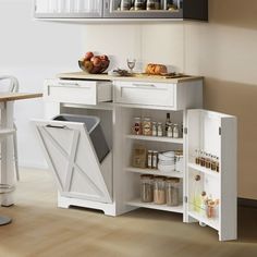 a kitchen with white cabinets and shelves filled with food