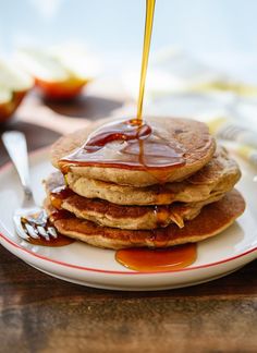 a stack of pancakes with syrup on top