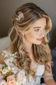 a woman in a wedding dress is holding a bouquet and looking off to the side