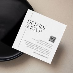 a black plate with a white business card on it