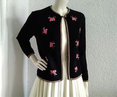 60s embroidered cardigan, elegant black sweater, pink floral embroidery, cropped wool spring jacket, folk rustic style cardigan, feminine romantic cardigan. ,, reine schurnwolle " writed on label means pure new wool. The cardigan is not washed or dry clean. vintage items always show signs of being worn measurements laying flat : shoulders :40 cm (15,5 inches) bust:48 cm (19 inches) total lenght :52 cm (20,5 inches) sleeve lenght :54 cm (21 inches) Vintage Black Sweater For Spring, Black Vintage Sweater For Spring, Elegant Embroidered Spring Sweater, Fitted Sweater With Floral Embroidery For Spring, Fitted Embroidered Pink Cardigan, Pink Embroidered Fitted Cardigan, Fitted Pink Embroidered Cardigan, Vintage Black Cardigan For Spring, Embroidery Cardigan