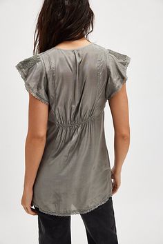 Effortlessly femme, this tunic-length top features a deep V-neckline and fluttery short-sleeves with embroidered detailing and lace trim. **Fit:** Relaxed fit, tunic-length style **Features:** Shiny fabrication, deep V-neckline, gathered bust detail, fluttery short-sleeves, lace trim, shirred back detail **Why We ❤ It:** This timeless tunic can be dressed up or down for whatever the occasion. | Moonlight Tunic by Free People in Blue, Size: XS Trim Fit, Tunic Length, Lace Trim, Free People, Dress Up, Short Sleeves, Relaxed Fit, Trim, Lace