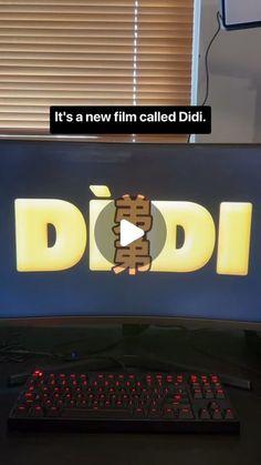 a computer screen with the words didi on it and a keyboard next to it