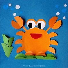 a paper cut out of an orange crab with bubbles on it's head and eyes