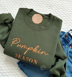 Fall sweatshirt, Embroidered Pumpkin Season Crewneck Pumpkin Sweatshirt, Pumpkin Sweater, Autumn Shirt Thanksgiving Sweatshirt, Fall Outfit ---HOW TO ORDER---   FOR EACH SHIRT CHOOSE: **Shirt type, size and color ---UNISEX SIZING--   Please see size chart in the pictures ---PRODUCT DETAILS--- Gildan Crewneck UNISEX Sweatshirt 50% cotton, 50% polyester Pre-shrunk Air jet yarn for softer feel and reduced pilling Double-needle stitched collar, shoulders, armholes, cuffs, and hem Gildan Crewneck UNI Green Cotton Sweater For Fall, Fall Embroidered Logo Long Sleeve Hoodie, Fall Long Sleeve Hoodie With Embroidered Logo, Fall Hoodie With Embroidered Logo And Long Sleeves, Fall Crew Neck T-shirt With Letter Print, Fall Crew Neck Sweater With Letter Print, Crew Cotton Sweater For Fall, Long Sleeve Fleece T-shirt For Fall, Green Cotton Sweatshirt For Fall