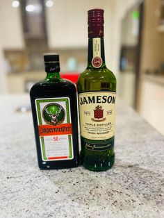 two bottles of jameson sitting on top of a counter