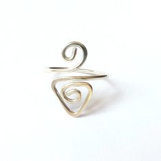 This triangle spiral ring is handcrafted with solid Sterling Silver. ❀ Easily adjustable, so perfect for gifts - just choose Small, Medium or Large. ❀ Or for a custom fit, tell us your ring size or measurement when you order. ❀ Made with 935 Sterling Silver, which has excellent shine and tarnish resistance. ❀ Your ring will be nicely gift wrapped and mailed in eco-friendly packaging. See more rings here... https://etsy.me/30DLNzN Adjustable Midi Rings With A Modern Twist For Gifts, Modern Twist Adjustable Midi Rings As Gift, Adjustable Spiral Promise Rings, Adjustable Spiral Rings With A Modern Twist, Adjustable Spiral Midi Rings In Minimalist Style, Adjustable Swirl Ring As Gift, Adjustable Spiral Ring With Modern Twist, Adjustable Spiral Ring With A Modern Twist, Handmade Spiral Minimalist Rings