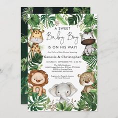 a baby shower with jungle animals and palm leaves