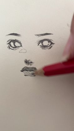 someone is drawing a woman's face with a pencil