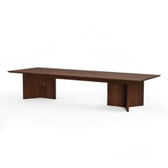 a wooden table sitting on top of a white floor