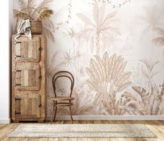 a chair sitting in front of a wall with palm leaves on it and a rug next to it