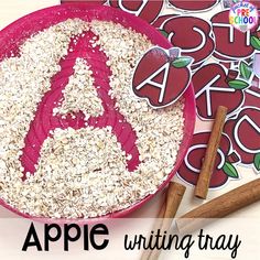 the letter a is made out of oatmeal in front of an apple and cinnamon stick