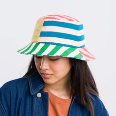 Knit bucket hat with colorblock stripe patchwork. Made from colorful, soft hypoallergic yarn. From sunny summer beach days to cold winter walks, this bucket hat is destined for year-round wear. Each hat is one of a kind – patchwork pattern placement may vary, but that's the fun of it! Fully lined. Details Body: 100% Acrylic Lining: 100% Deadstock poly-cotton fabric Machine wash gentle, lay flat to reshape and dry8.5"w, 3.5"h, 2.25" brim, 22" interior circumference Trendy Multicolor Bucket Hat With Curved Brim, Trendy Multicolor Curved Brim Bucket Hat, Fun Multicolor Bucket Hat With Short Brim, Fun Multicolor Bucket Hat For Spring, Fun Multicolor Short Brim Bucket Hat, Trendy Multicolor Bucket Hat For Spring, Playful Multicolor Wide Brim Sun Hat, Multicolor Wide Brim Bucket Hat, Multicolor Casual Bucket Hat