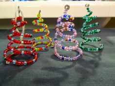 three colorful bracelets sitting on top of a table