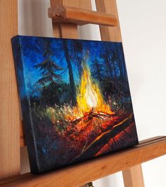 an oil painting of a fire in the woods on a wooden shelf next to a ladder