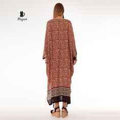 Introducing our stunning Brown Bat Wing Maxi Dress, a true statement piece for your wardrobe! This elegant long sleeve long dress is perfect for any occasion, whether you're dressing up for a special event or simply looking to add a touch of glamour to your everyday style. The unique bat wing design adds a fun and playful twist to this classic silhouette, making it a must-have piece for any fashion-forward individual. Elevate your look with this effortlessly chic and versatile dress that will tu Summer Long Sleeve Flowy Abaya, Summer Flowy Long Sleeve Abaya, Elegant Long Sleeve Printed Kaftan, Flowy Long Sleeve Summer Abaya, Flowy Summer Abaya, Brown Printed Long Sleeve Maxi Dress, Printed Long Sleeve Brown Maxi Dress, Brown Long Sleeve Boho Dress For The Beach, Long Sleeve Brown Boho Dress For The Beach