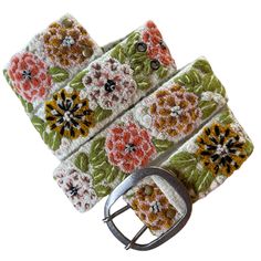 Our beautiful Andina floral belts are hand loomed in 100% wool yarns and hand embroidered with beautiful embelishments colored with natural dyes!  - Embroidered in 100% sheep wool - Hand embroidered 100% cotton - Biodegradable dyes  The belts have 5 sets of holes spaced 2" apart and they are versatile; you can wear the same belt around your waist or hips.   2" Wide Size:  Size: Smal (fits most sizes 0-4) Length to first hole from buckle: 24 inches Length to last hole from buckle: 32 inches Total Length: 36 inches Size: Medium (fits most sizes 6-12) Length to first hole from buckle: 29 inches Length to last hole from buckle: 37 inches Total Length: 41 inches Size: Large (fits most sizes 12-16) Length to first hole from buckle: 35 inches Length to last hole from buckle: 43 inches Total Lengt Floral Belts, Bohemian Embroidered Belts With Multicolor Embroidery, Folk Style Adjustable Embroidered Belt, Folk Style Multicolor Embroidered Belt, Bohemian Multicolor Embroidered Belt, Artisan Multicolor Fabric Belt, Flower Belt, Embroidered Belt, Organic Plants