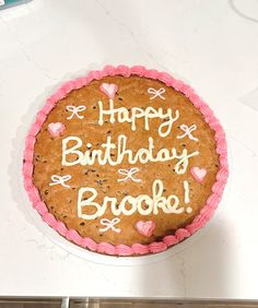 a birthday cake with the words happy birthday brooke written on it