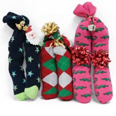 three christmas stockings are lined up next to each other