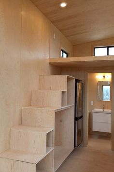 the stairs are made out of plywood and have been built into the wall for storage