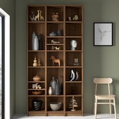 a wooden bookcase filled with lots of different items